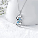 Colar Prateado com Golfinhos Duplos e Cristal Azul