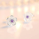 Brincos em forma de flor com zirconia