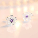 Brincos de botão em forma de flor com zircónias