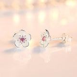 Brincos em forma de flor com zirconia