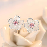 Brincos em forma de flor com zirconia