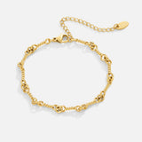 Pulseira de corrente Figaro dourada com nó