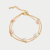 Pulseira em camadas com detalhe delicado