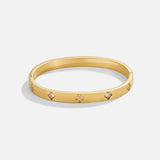 Pulseira rígida dourada com trevo