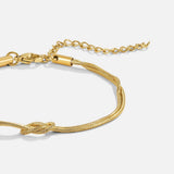 Pulseira de corrente dourada com nó