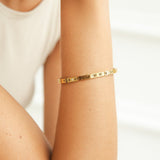 Pulseira rígida dourada Roman
