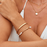 Pulseira rígida dourada Tara