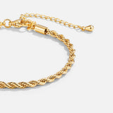 Pulseira dourada torcida